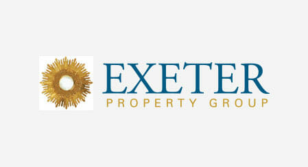 Exeter Property Group logo featuring a stylized golden sunburst emblem on a white background.