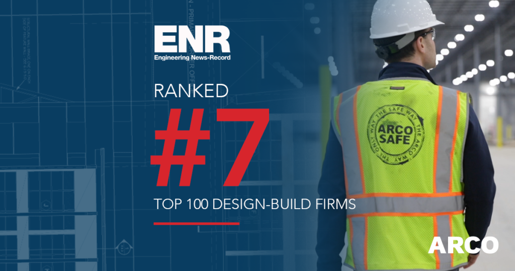 ENR ranks ARCO #7 among top 100 design-build firms. Worker in safety vest with ARCOSAFE logo in warehouse.